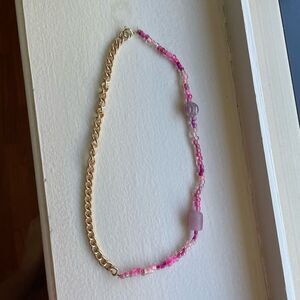 Beaded necklace with pink beads and gold chain